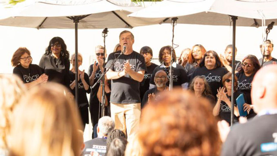 Attendees at Carl Zeiss Vision Inc.'s annual sales meeting enjoyed a performance after assembling and donating more than 2,000 sanitation kits for Voices of the City, a nonprofit choir organization that aids those experiencing homelessness.