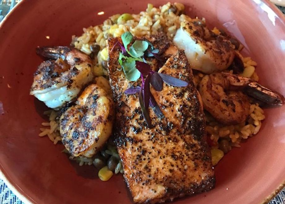 Pan-roasted salmon with peas, succotash and pecan brown butter is a favorite at Prime Meridian.