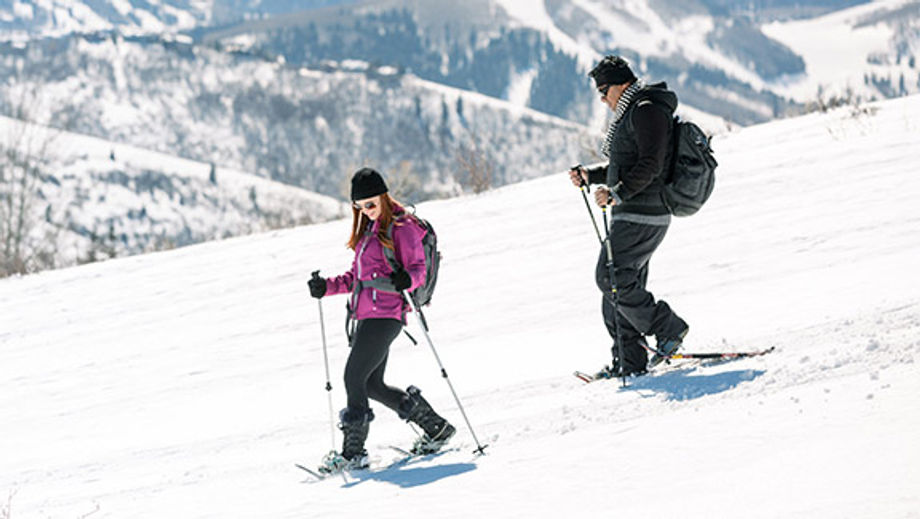 Snowshoeing on a mountain, park city chamber bureau