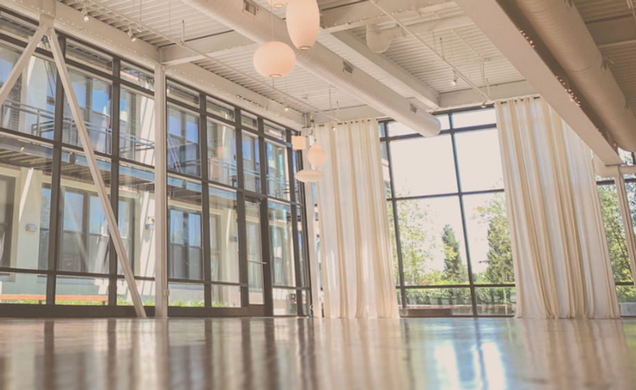 Floor-to-ceiling windows bring the light inside the Greenhouse Loft.