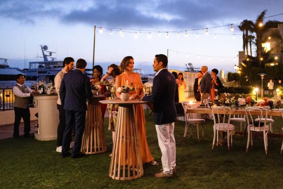 When hosting events out of doors, it's wise to create comfortable spaces for small groups to gather, and be protected from the sun during the day or illuminated in the evening.