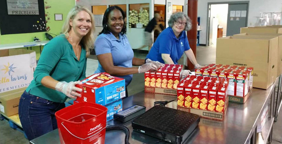 The Greater Lansing CVB sorted groceries at a local food bank to celebrate service