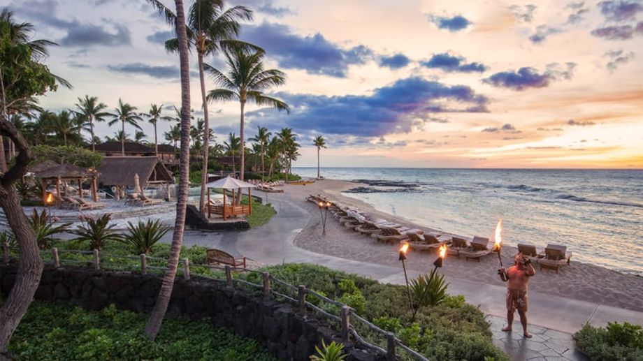 At the Four Seasons Resort Hualalai on Hawaii's Big Island, it's tradition to blow the conch shell at sunset.