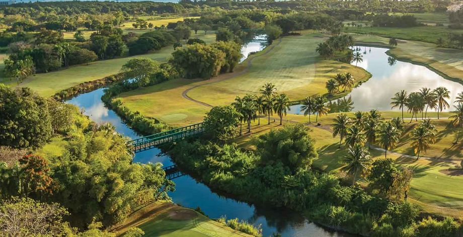 A river runs through the golf courses at the Wyndham Grand Rio Mar Puerto Rico Golf & Beach Resort.