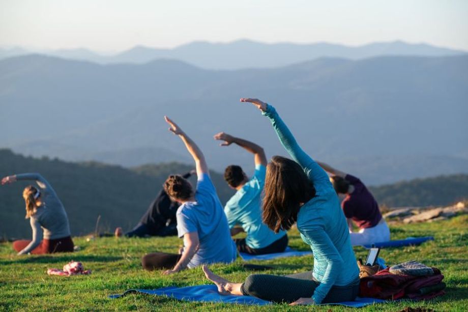 The stunning natural landscape surrounding Asheville makes it ideal for outdoor wellness activities, such as yoga.