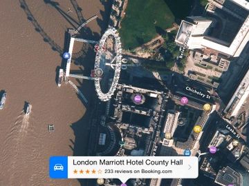 Booking.com and TripAdvisor reviews appear on Apple Maps