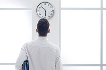 Worker Watching Clock
