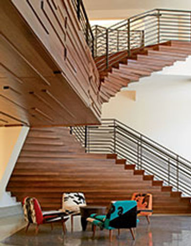 Design elements like the floating
staircase in The James Royal Palm
give downtown hotels a chic feel