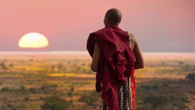 A Masai warrior at sunset // © 2014 Thinkstock