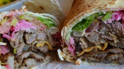 A shawarma sandwich stuffed with lamb, pickles and tahini is a popular lunch item in Lebanon. // © 2017 Creative Commons user avlxyz