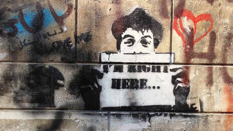 This stencil art of a young boy may express the artist’s political opinions.