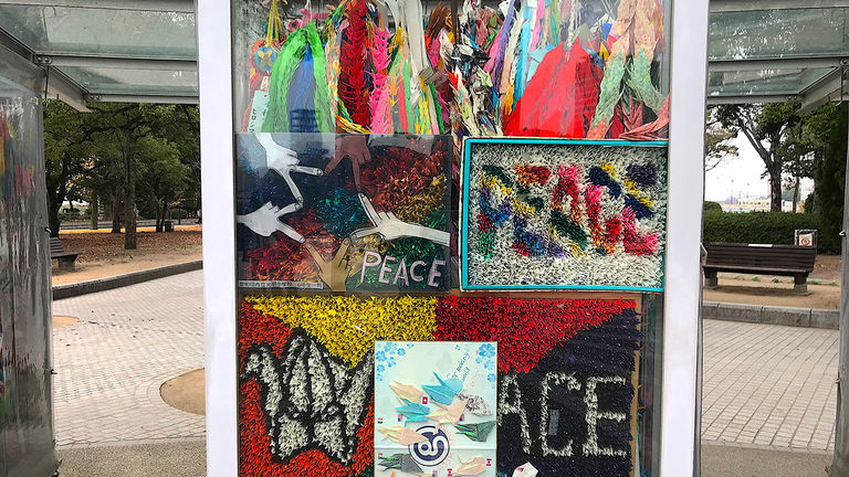 The Children’s Peace Monument features glass cases filled with origami paper cranes.