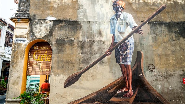 Hunt for street art in George Town by artist Ernest Zacharevic.