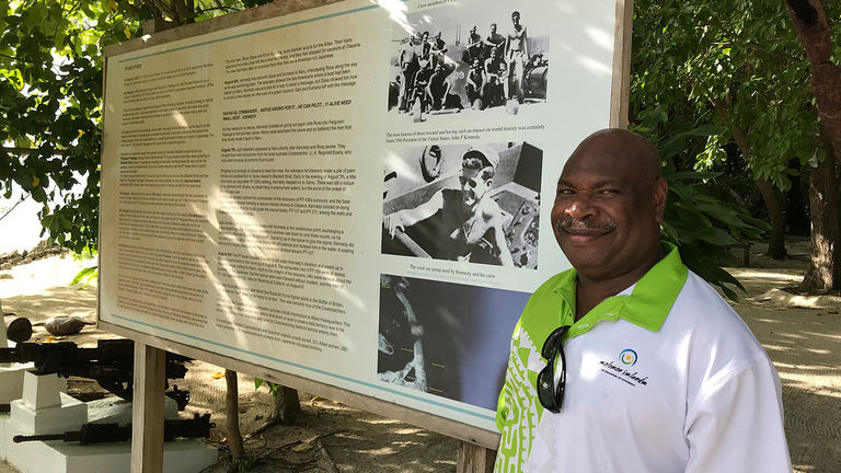 Tourism Solomons’ Ellison Kyere poses on Kennedy Island, which was named after former U.S. president John F. Kennedy, who served here during his naval career.