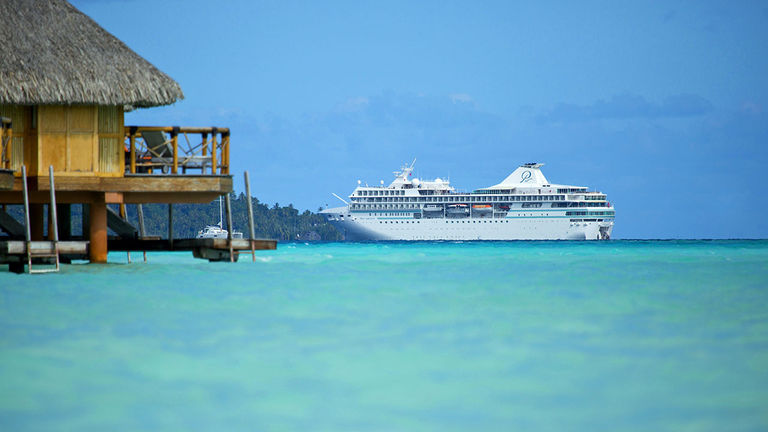 The 400-passenger Paul Gauguin, seen here off the coast of Bora Bora, is slated to begin sailings in the Islands of Tahiti for international travelers this August.