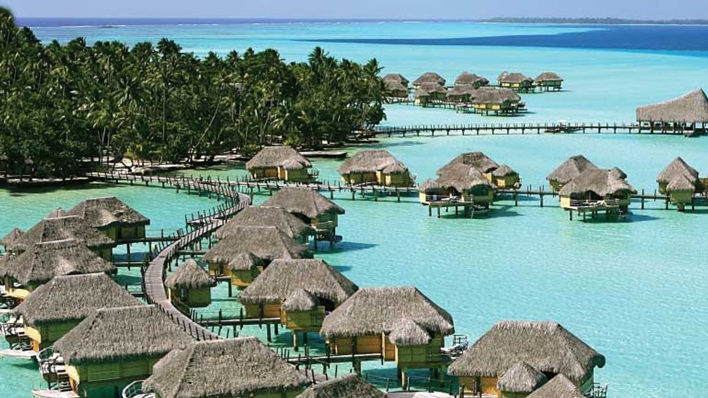 Le Tahaa offers Polynesian-style overwater bungalow suites. // © 2013 Le Tahaa Island Resort & Spa 3
