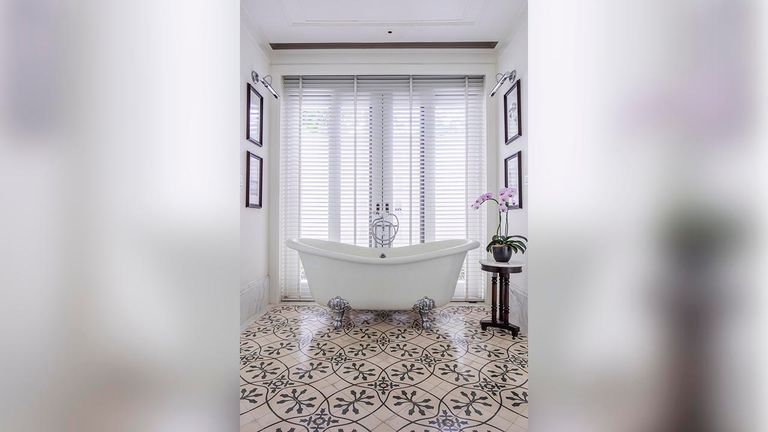 Bathrooms feature clawfoot Victoria tubs and separate showers.