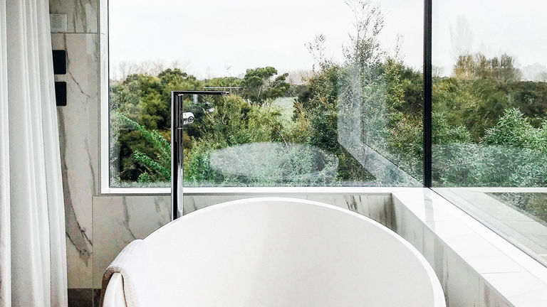 Olive House’s soaking tub comes with a striking view.