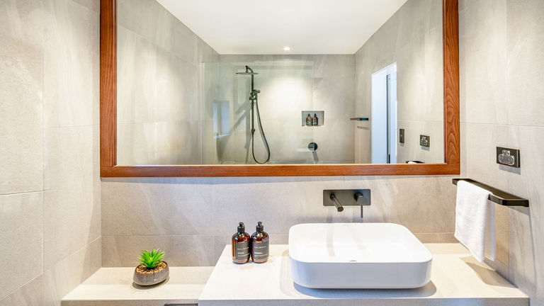 Guestroom bathrooms feature Real World toiletries.