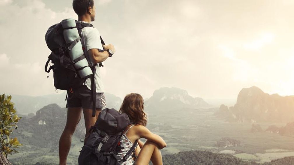 Hikers on edge of cliff // © 2013 Thinkstock F