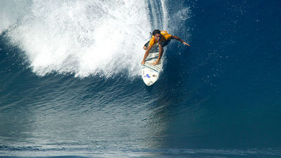 Gold drops in at the Bonzai Pipeline on Oahu's North Shore. // © 2014 Mark Berkowitz