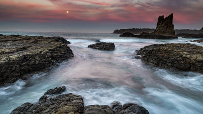 Consider visiting Cathedral Rock, located on the south coast of New South Wales, at sunset.
