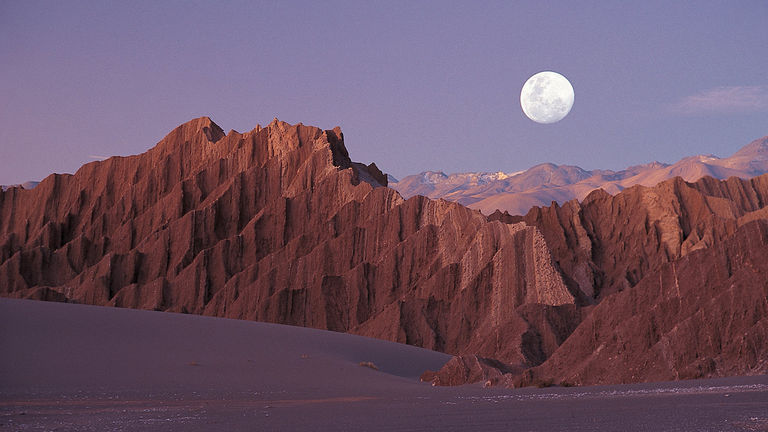 Chile's Atacama Desert features rocky mountains, conical volcanoes, sand dunes, sal flats, lagoons and more.