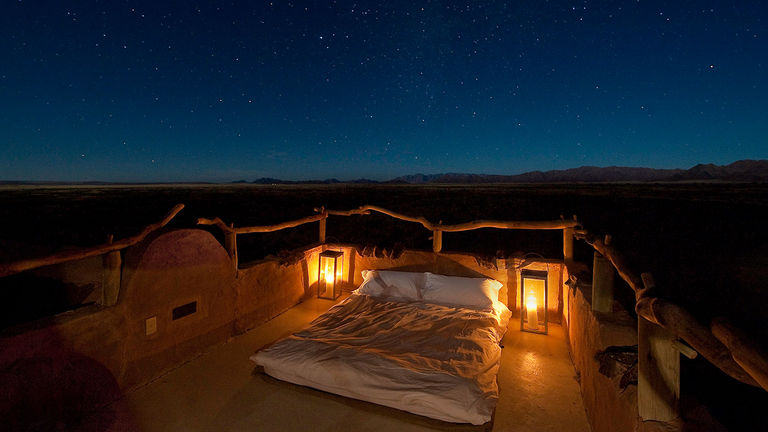 Get a good (and beautiful) night's rest by sleeping on a rooftop "star bed" in the Namib.