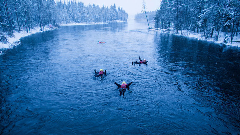 Travelers can float down the icy Kitkajoki River.