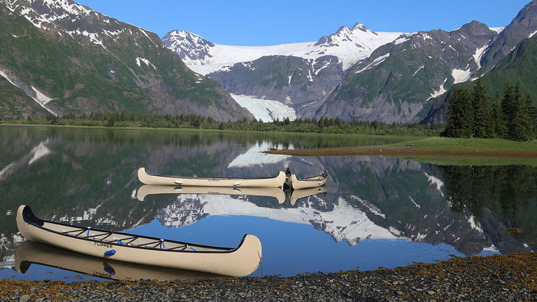 The lodge and cabins face Pedersen Glacier and Pedersen Lagoon, which is often patrolled by black bears.