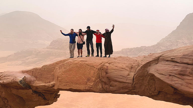 With the assistance of a Bedouin, the group scrambled up to Burdah Rock Bridge’s arch, which sits 263 feet above the surrounding rock.