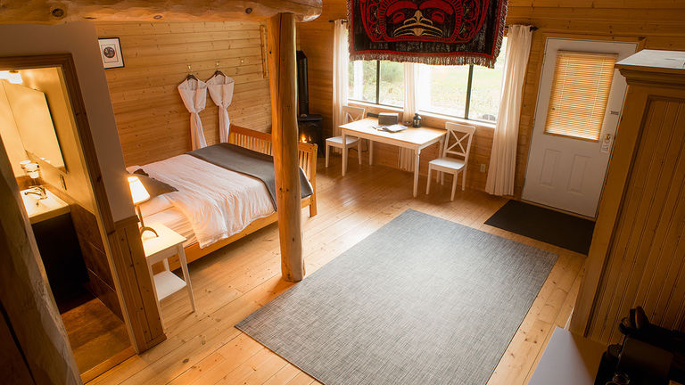 Guests at the lodge stay in timber-framed cabins.