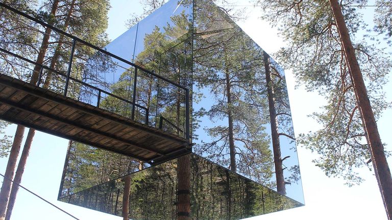 Treehotel’s Mirrorcube  blends into its surroundings.