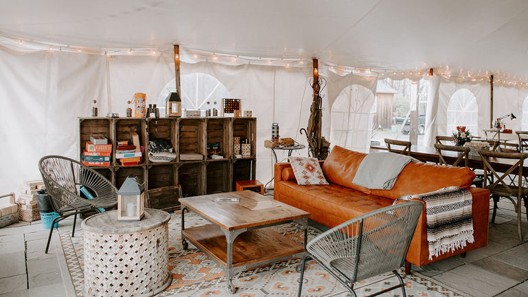 Travelers will love relaxing in the Lobby Tent at Ithaca by Firelight Camps.