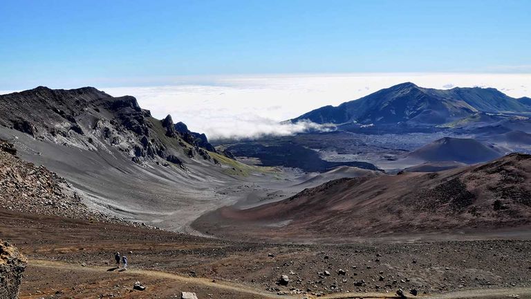 Hikers can explore the rugged beauty of Haleakala’s summit region.