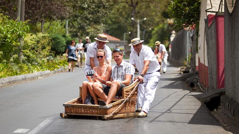 Travel back down to Funchal by toboggan sled.