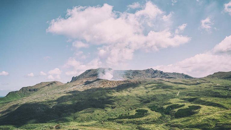 Mount Aso rises from the grassy central plateau on Japan’s southwest island Kyushu.