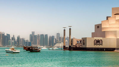 The Middle Eastern country blends new and old, with its modern architecture and traditional “dhow” wooden boats. // © 2017 iStock