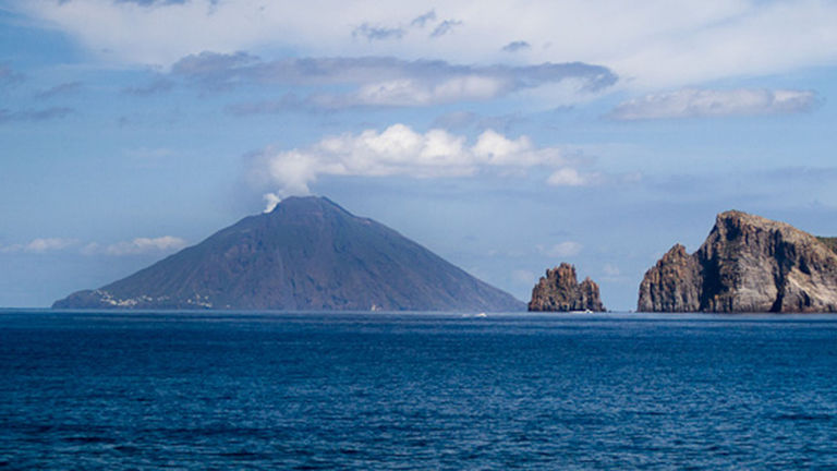 Stromboli rises sharply from the sea and at night creates stunning displays as lava shoots down its face.