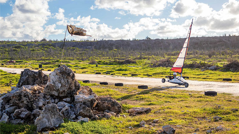 Bonaire boasts a distinctive desert landscape and offers unique outdoor activities such as land sailing.