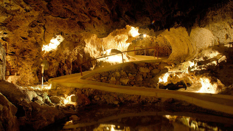 Hato Caves on Curacao feature large chambers and interior pools.