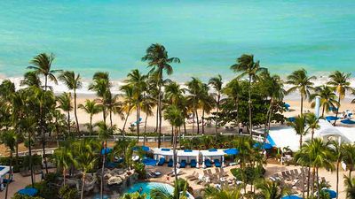 The recently renovated InterContinental San Juan, which has 397 guestrooms with 21 suites, sits on a 2-mile stretch of white, sandy beach. // © 2016 Intercontinental San Juan