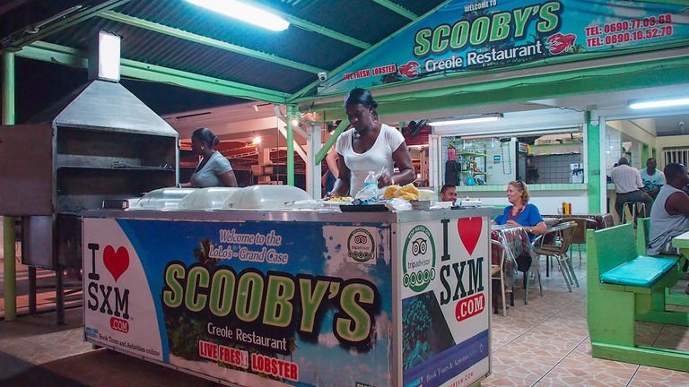 Try simple Caribbean fare at local “lolos,” such as the one pictured above.