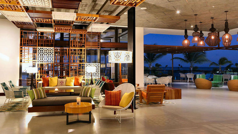 Travelers can relax and recharge in the TRS Cap Cana Hotel lobby.