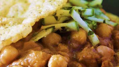 Fried flatbread sandwiches called “doubles” are usually filled with curried chickpeas and dressed with a choice of mango chutney, tamarind sauce, pepper sauce and coconut. // © 2016 Trinidad & Tobago Tourism Development Company