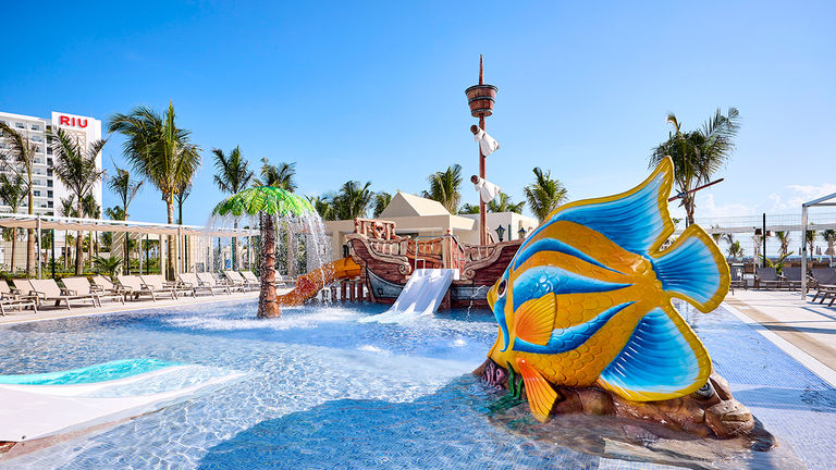 The property includes four pools, one of which includes slides and a splash park for kids.
