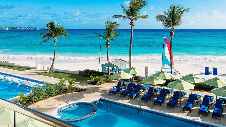 Sea Breeze Beach House offers three swimming pools for guests, including an adults-only pool and a lap pool.