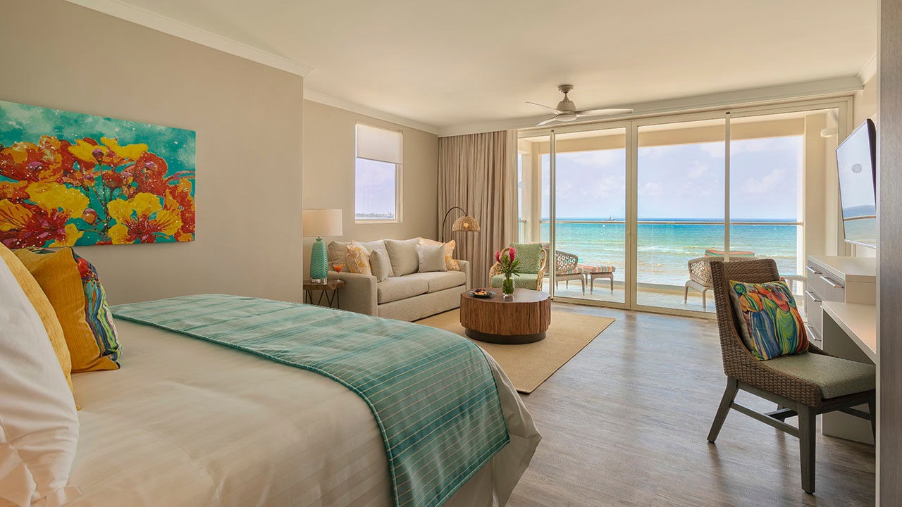An oceanfront junior suite at Sea Breeze Beach House