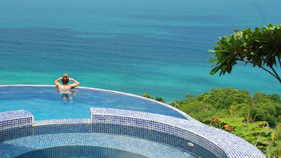 Anamaya Resort is perched on a steep hillside above Montezuma, Costa Rica, offering views of the ocean and the rainforest from its infinity pool.  // © 2014 Greg Olsen