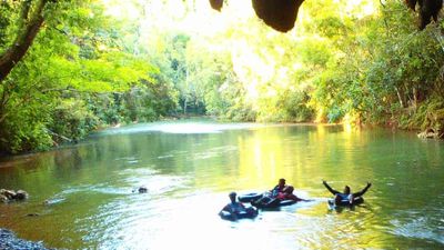 Cave tubing takes clients into a limestone cave system filled with rock formations. // © 2014 Island Expeditions 2